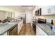 Modern kitchen features stainless appliances, granite countertops, and a view of dining area at 1064 20Th Avenue Se Loop, Hickory, NC 28602