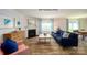 Inviting living room boasts a fireplace, wood-look floors, and windows for natural light at 1064 20Th Avenue Se Loop, Hickory, NC 28602