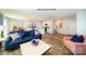 Spacious open-concept living room features a connected kitchen, dining area and staircase at 1064 20Th Avenue Se Loop, Hickory, NC 28602
