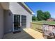 A relaxing wooden deck offers seating and sliding door access to the backyard and firepit at 109 Hunter Ct, Oakboro, NC 28129