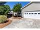 Charming home featuring a 2-car garage, a neatly kept lawn, and beautiful landscaping, enhancing curb appeal at 109 Hunter Ct, Oakboro, NC 28129