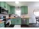 Well-lit kitchen features stainless appliances, wood countertops, and modern fixtures at 109 Hunter Ct, Oakboro, NC 28129