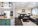 Comfortable living room with large windows, and comfortable furniture at 109 Hunter Ct, Oakboro, NC 28129