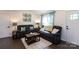 Cozy living room with lots of comfortable seating and natural light at 109 Hunter Ct, Oakboro, NC 28129