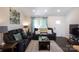 Comfortable living room features a plush sectional sofa and a view of the front entry at 109 Hunter Ct, Oakboro, NC 28129