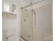Updated bathroom featuring frameless glass shower with rainfall showerhead, and modern toilet at 1101 W 1St St # 408, Charlotte, NC 28202