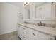 Bathroom vanity with marble countertops, dual sinks, and updated faucets and hardware at 1101 W 1St St # 408, Charlotte, NC 28202