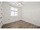 Bright bedroom showcasing a window with blinds and luxury vinyl plank flooring at 1101 W 1St St # 408, Charlotte, NC 28202