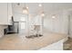 Well-lit kitchen boasting granite countertops, stainless steel appliances, and ample cabinet space at 1101 W 1St St # 408, Charlotte, NC 28202