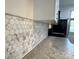 Close-up view of kitchen featuring granite countertops and a stylish backsplash at 1101 W 1St St # 408, Charlotte, NC 28202