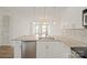 Open kitchen with stainless steel appliances, granite countertops, and a view into the living space at 1101 W 1St St # 408, Charlotte, NC 28202