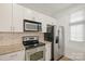 Sleek kitchen showcasing stainless steel appliances, granite counters, and stylish backsplash at 1101 W 1St St # 408, Charlotte, NC 28202