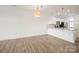 Open-concept living space with hardwood floors, a modern kitchen, and ample room to entertain at 1101 W 1St St # 408, Charlotte, NC 28202