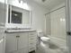 Clean bathroom featuring vanity with marble countertop, tile floors and a shower-tub combination at 1101 W 1St St # 408, Charlotte, NC 28202