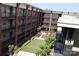 Exterior view of a courtyard area with artificial turf, planters, and brick building surround at 1101 W 1St St # 408, Charlotte, NC 28202