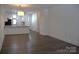 Open-concept living space with wood floors, seamlessly connecting to the kitchen area at 1101 W 1St St # 408, Charlotte, NC 28202