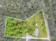 An aerial view reveals the property's boundaries and showcases a home surrounded by trees and lush greenery at 115 Patterson Rd, Kings Mountain, NC 28086