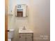 Bathroom featuring a vanity sink, mirror, and a clean, functional layout at 115 Patterson Rd, Kings Mountain, NC 28086