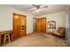 Spacious bedroom with ceiling fan, dual closets and a cozy seating area at 115 Patterson Rd, Kings Mountain, NC 28086