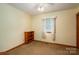 Neutral bedroom with a cozy ambiance, with a bookshelf and window at 115 Patterson Rd, Kings Mountain, NC 28086