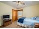 Cozy bedroom with a ceiling fan, carpeted floor, and a blue comforter at 115 Patterson Rd, Kings Mountain, NC 28086