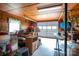 Interior view of a garage with a white door, wood paneling, and storage at 115 Patterson Rd, Kings Mountain, NC 28086