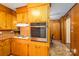 Well-maintained kitchen features wood cabinets and stainless steel built in oven at 115 Patterson Rd, Kings Mountain, NC 28086