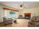 Bright living room with a fireplace, large windows, and cozy seating for a relaxing atmosphere at 115 Patterson Rd, Kings Mountain, NC 28086