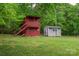 Two outbuildings stand on a well-maintained lawn, providing versatile space for hobbies, storage, or creative pursuits at 115 Patterson Rd, Kings Mountain, NC 28086