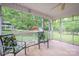 Screened-in porch with patio furniture, perfect for outdoor relaxation at 115 Patterson Rd, Kings Mountain, NC 28086
