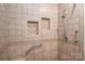 Tiled shower featuring built-in shelves and modern fixtures at 115 Patterson Rd, Kings Mountain, NC 28086