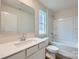 Bright bathroom featuring a white quartz countertop, single sink, and a shower-tub combination at 118 Dorian Pl, Troutman, NC 28166