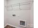 A utility room includes the connection point for a washer and dryer and features wire shelving at 118 Dorian Pl, Troutman, NC 28166