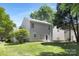 The backyard features a well-manicured lawn and partial shade at 12624 Cedar Crossings Dr, Charlotte, NC 28273