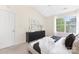 Bright bedroom with stylish decor, a plush bed, and view of the outdoors at 12624 Cedar Crossings Dr, Charlotte, NC 28273