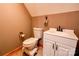 Bathroom featuring a toilet, decorative fixtures, and a white vanity with cabinet space at 1307 Tiffany Ln, Shelby, NC 28152