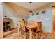 Dining room features a wood table with seating for six, hardwood floors, and decorative lighting at 1307 Tiffany Ln, Shelby, NC 28152