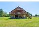 Inviting multi-level deck with a view of the spacious lawn and surrounding greenery at 1307 Tiffany Ln, Shelby, NC 28152