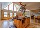 Bright kitchen features a large island, hardwood floors, pendant lighting and adjacent living area at 1307 Tiffany Ln, Shelby, NC 28152