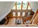 Sunlit living room with soaring windows, hardwood floors, and unique spiral staircase at 1307 Tiffany Ln, Shelby, NC 28152