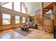 Bright living room with hardwood floors, a spiral staircase, and picturesque windows offering scenic views at 1307 Tiffany Ln, Shelby, NC 28152
