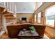 Charming living room featuring a spiral staircase, hardwood floors, and an abundance of natural light at 1307 Tiffany Ln, Shelby, NC 28152