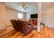 Cozy living room with hardwood floors, ceiling fan, and comfortable leather recliners at 1307 Tiffany Ln, Shelby, NC 28152