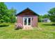 Charming outbuilding with double doors and surrounding green lawn in a serene setting at 1307 Tiffany Ln, Shelby, NC 28152