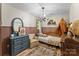 Charming bedroom with antique furniture, hardwood floors, and warm lighting at 1338 Pell Dr, Lincolnton, NC 28092