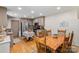 Spacious dining area with a wooden table, connecting seamlessly to the modern kitchen with stainless steel appliances at 1338 Pell Dr, Lincolnton, NC 28092
