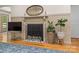 Inviting living room featuring a decorative fireplace, hardwood floors, and elegant decor accents at 1338 Pell Dr, Lincolnton, NC 28092