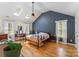 Bright main bedroom features a vaulted ceiling, skylights, and hardwood floors at 1338 Pell Dr, Lincolnton, NC 28092