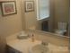 Bathroom showcasing the vanity, sink, fixtures, and toilet, offering a clean and functional space at 146 Barclay Ln, Mooresville, NC 28115