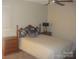 Cozy bedroom with a comfortable bed, a ceiling fan, and a wooden nightstand for convenience at 146 Barclay Ln, Mooresville, NC 28115
